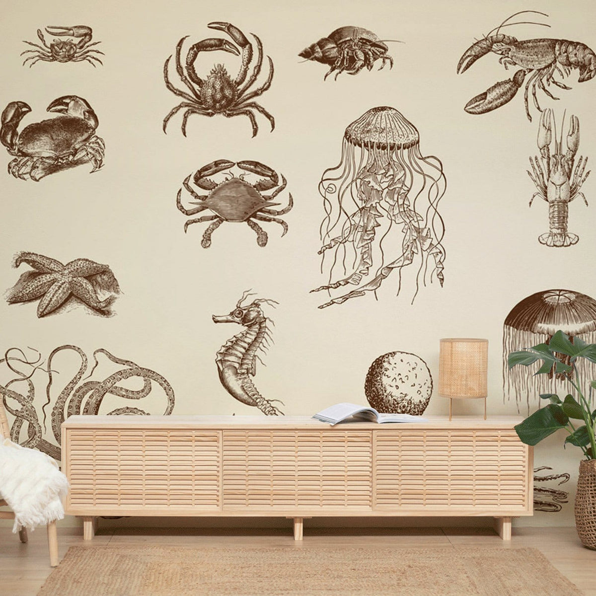 Vintage marine life sepia-patterned wallpaper in nautical living room with light wood furniture, neutral decor.