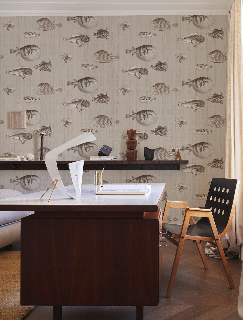Sepia nautical sketch wallpaper in elegant study with sleek wooden desk, modern chair, light curtains.