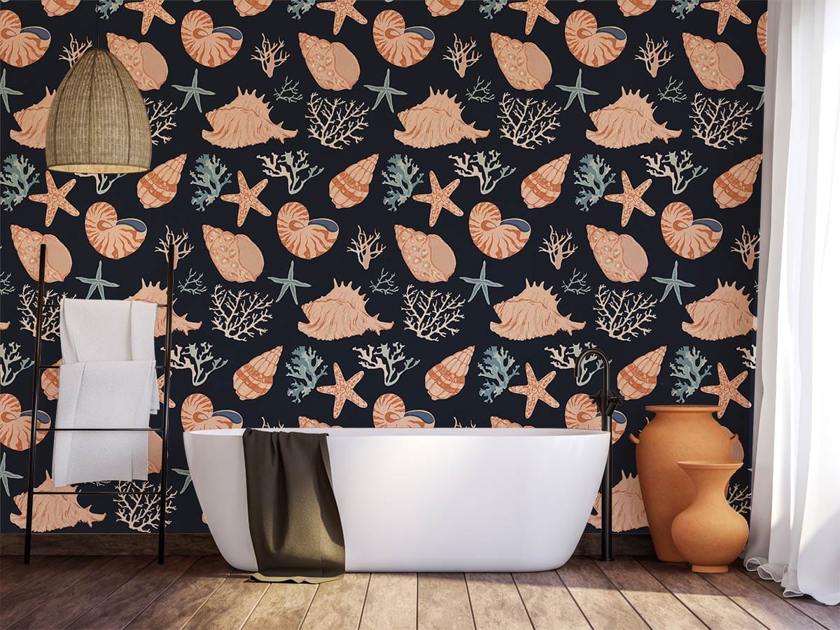 Nautical seashell wallpaper, navy and coral coastal design, bathroom setting, bathtub, wicker lamp, wooden flooring.