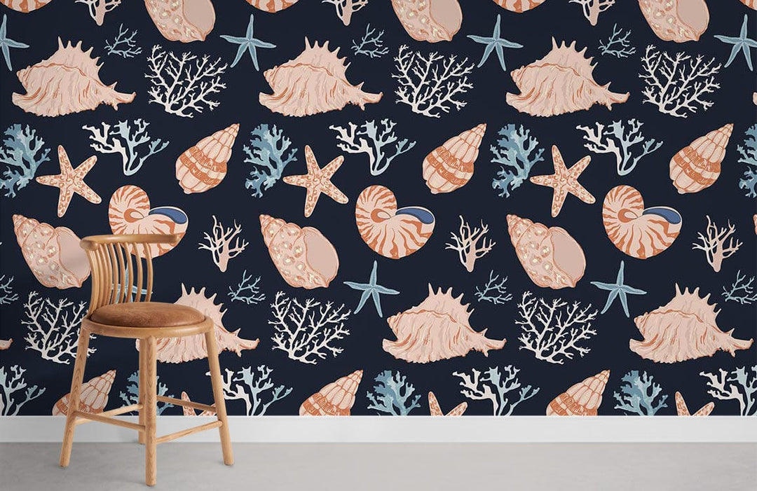 Nautical seashell pattern wallpaper in navy and coral coastal design, wooden chair, grey flooring.