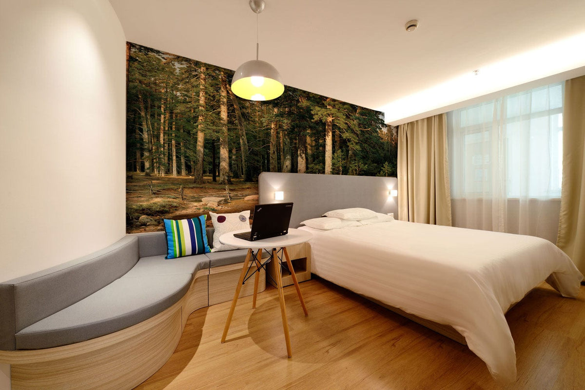 Bedroom with Tranquil Forest Stream Mural Wallpaper, grey sofa, wooden flooring, and elegant double bed.