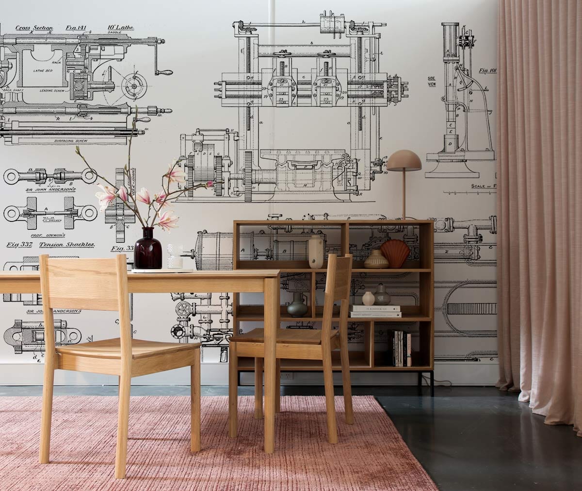 Vintage Industrial Blueprint Wallpaper in dining room with wooden furniture, pink rug, concrete flooring.