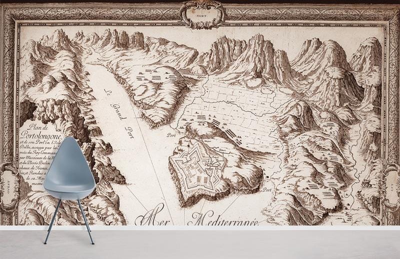 Vintage nautical map mural wallpaper in brown tones with grey contemporary chair on wood flooring.