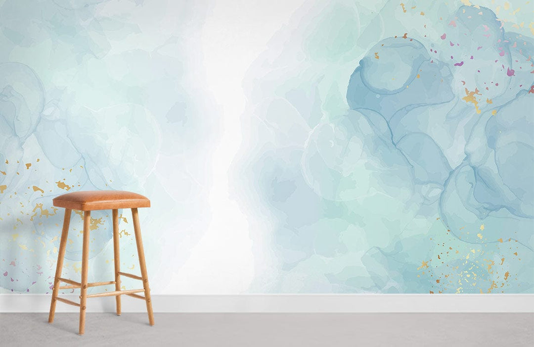 Tranquil Watercolour Bliss wallpaper with gold and blue abstract design, featuring a wooden stool, grey flooring.