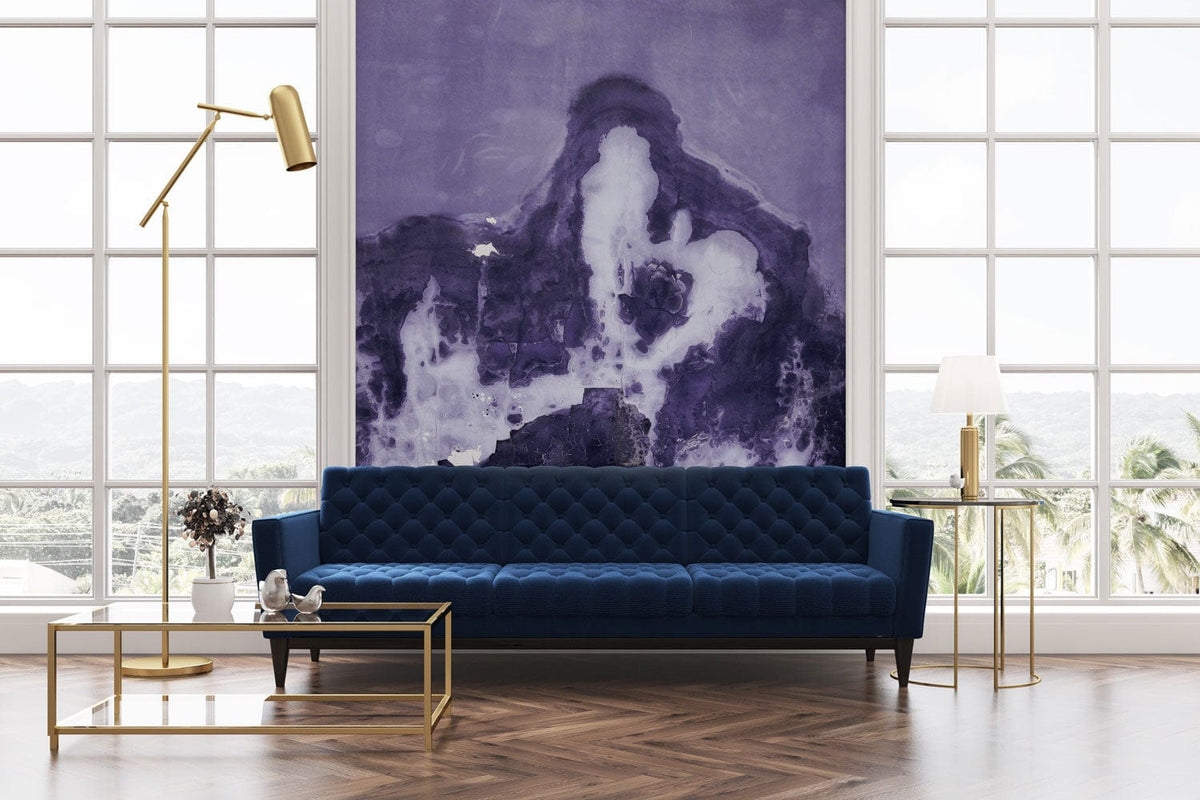 Purple abstract wall mural with textured watercolour design, navy blue sofa, parquet flooring, modern living room.