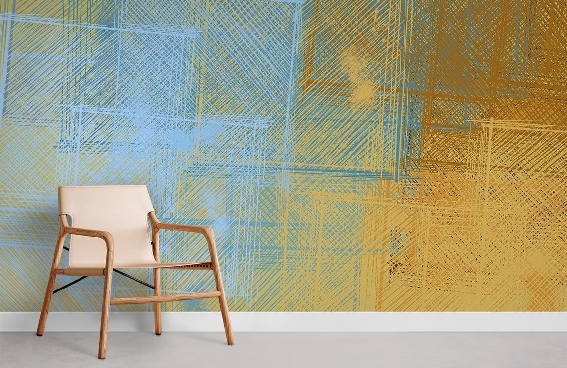 Abstract blue and gold geometric wallpaper with beige chair, modern design, grey flooring in living room.