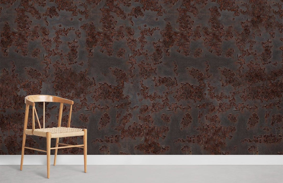 Rustic industrial metal-effect mural wallpaper with wooden chair, grey flooring, neutral room setting.