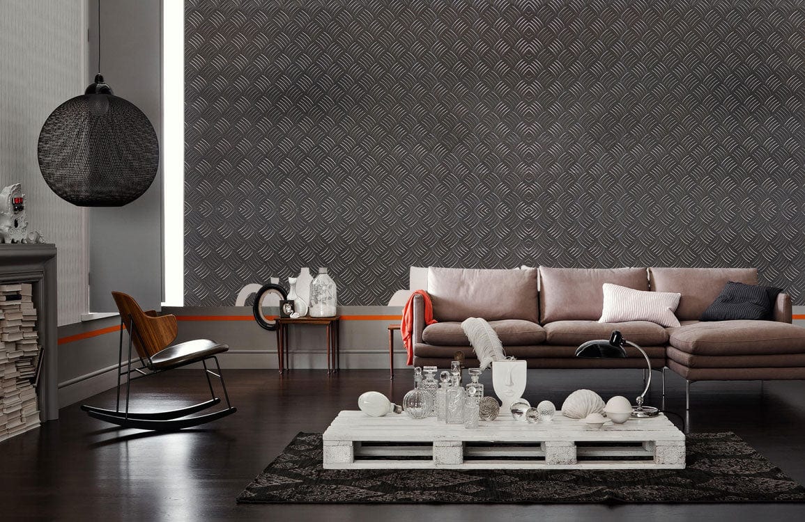 Industrial chic grey wallpaper, modern living room, brown sofa, dark wood flooring, textured wall design.
