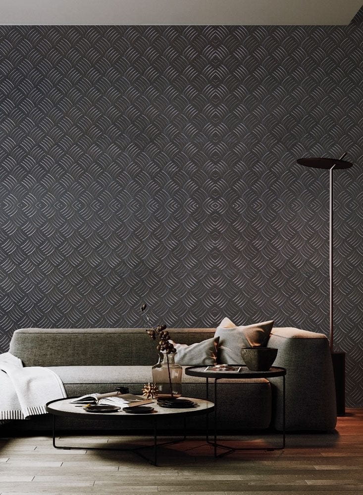 Grey metallic textured wallpaper, modern grey sofa, wooden flooring, floor lamp, stylish living room design.