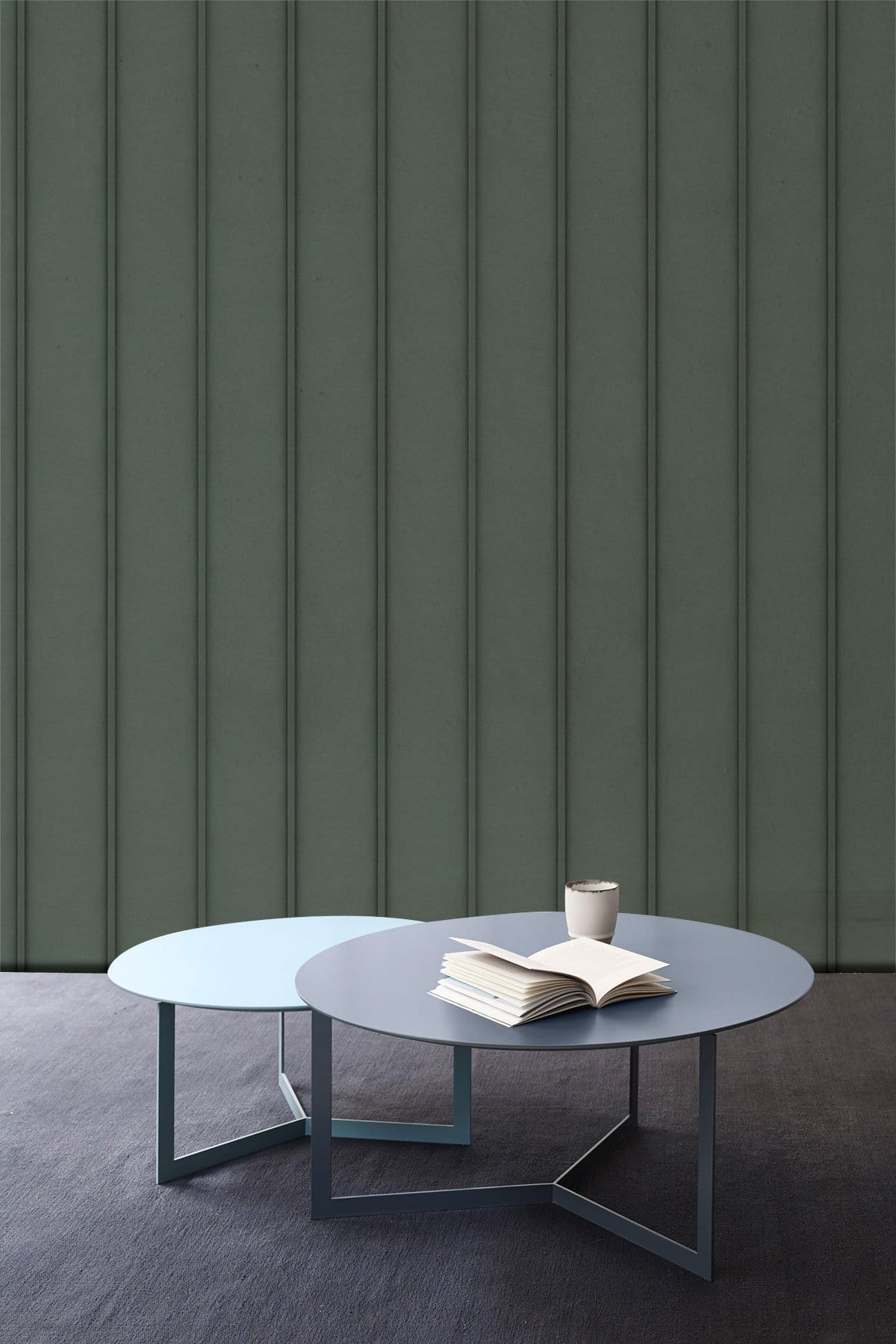 Elegant Charcoal Vertical Stripe Wallpaper with minimalist tables, dark flooring in modern interior setting.