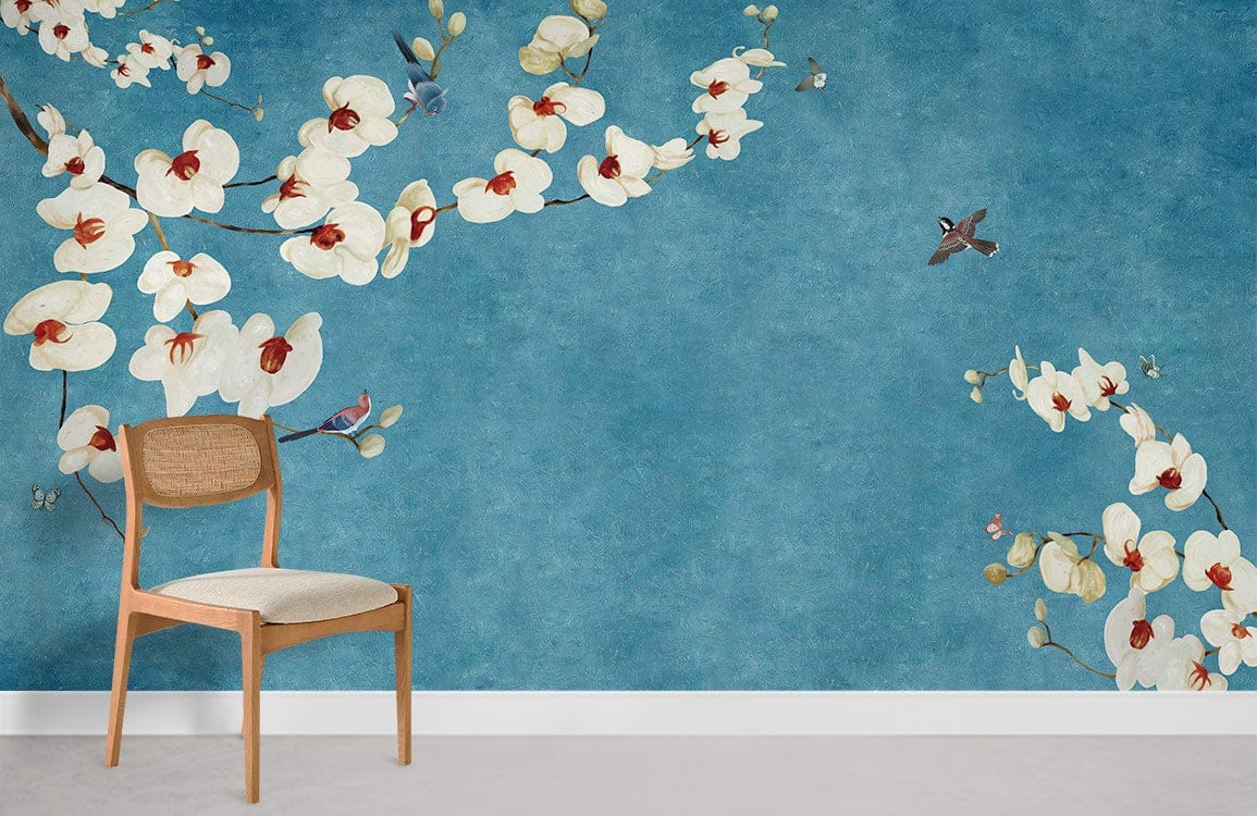 Orchid Blossom Blue Vintage Chinoiserie Mural Wallpaper with birds, wooden chair, smooth grey flooring.
