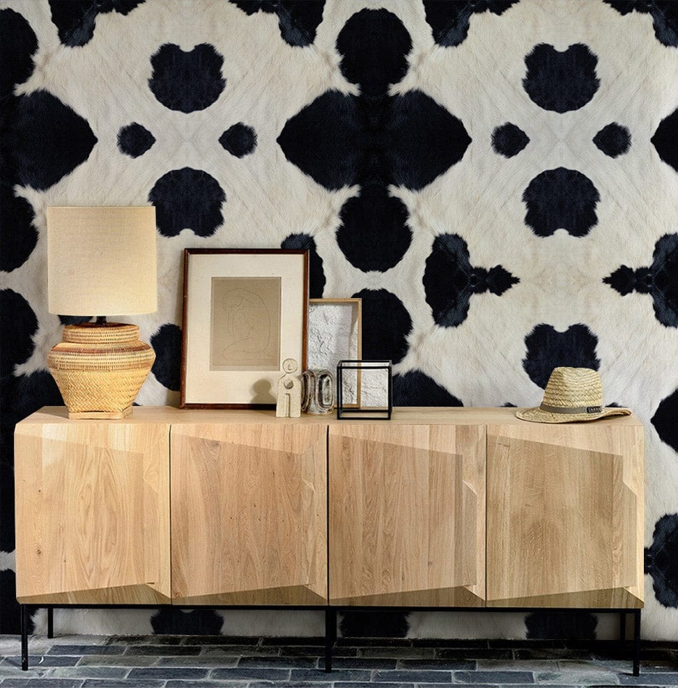 Monochrome abstract pattern wall mural with wooden cabinet and tiles in a modern living room.