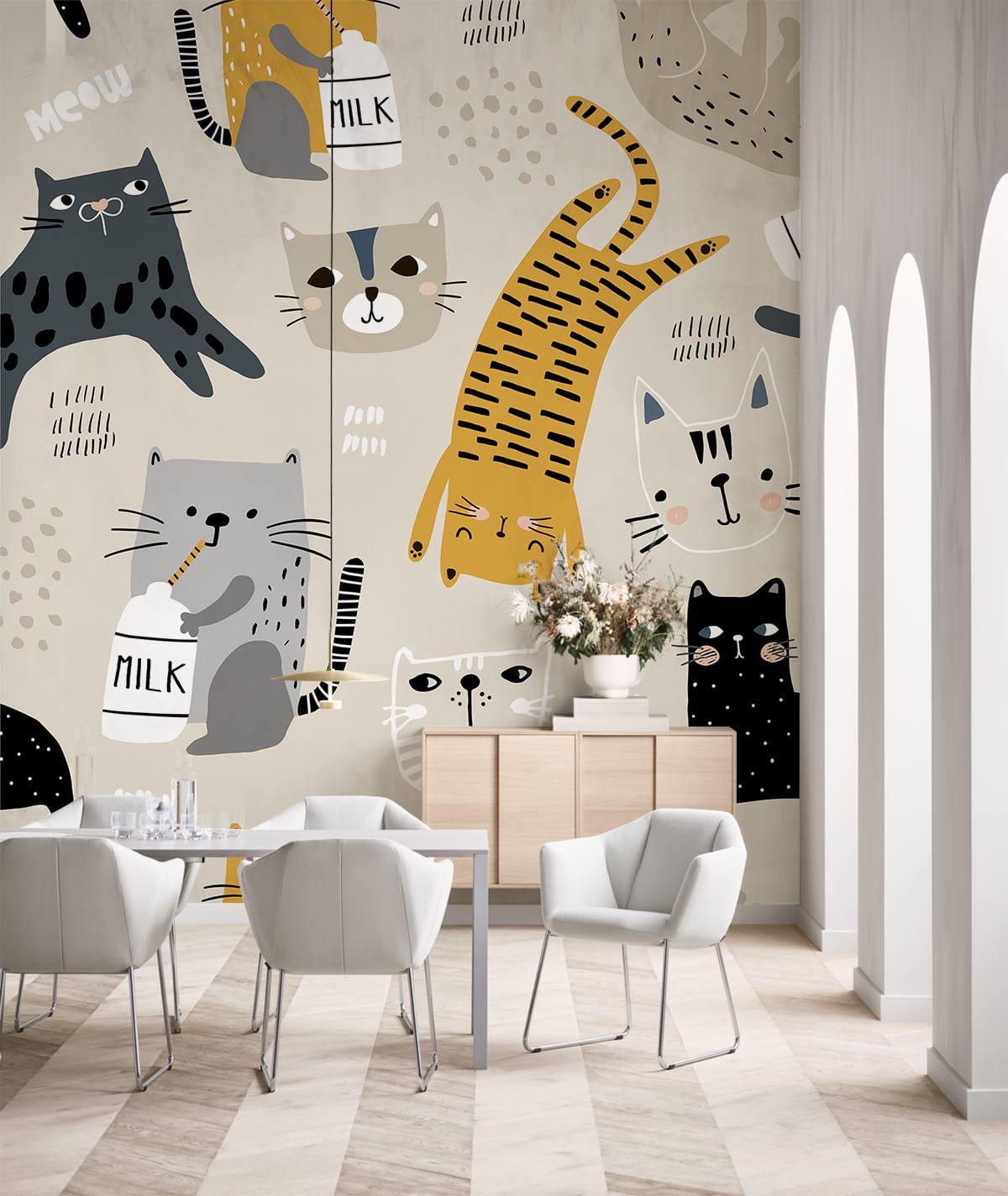 Cream kids mural wallpaper with playful cats, milk bottles; dining room with white chairs, wood flooring.