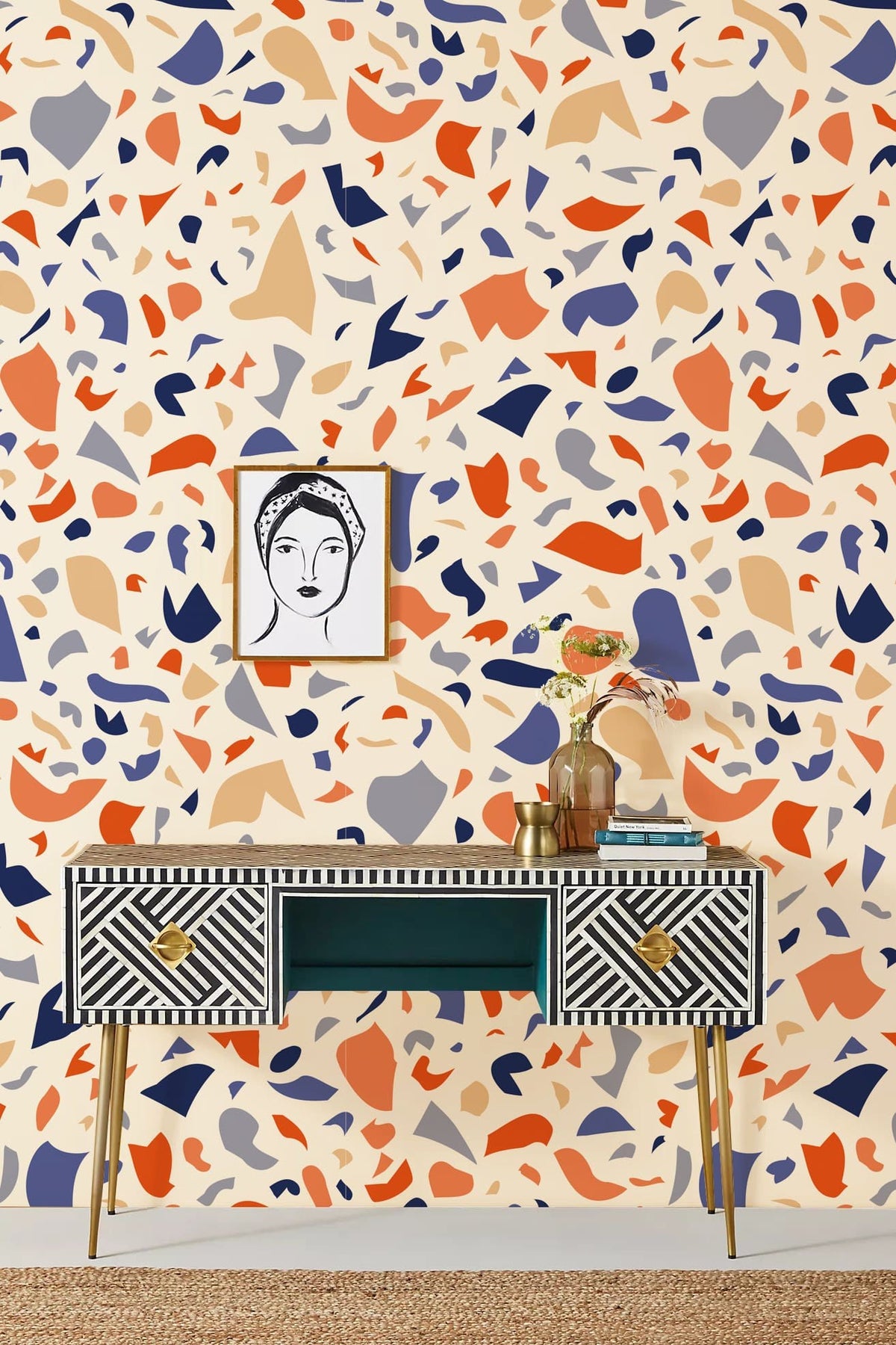 Colourful Terrazzo Effect Wallpaper in modern interior with abstract print, art piece, styled console table.