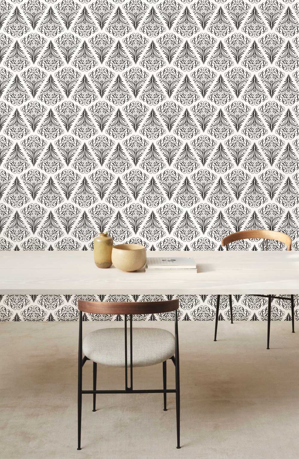 Monochrome geometric diamond wallpaper with minimalist dining table, chairs, and neutral flooring in modern room.