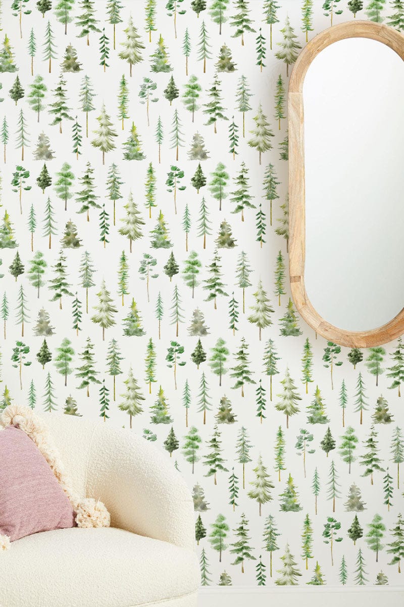 Modern interior with Tranquil Green Forest wallpaper, cream sofa, wood-framed mirror complementing design.
