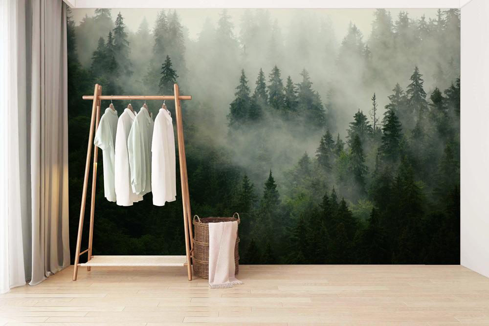 Mystical Misty Forest Mural Wallpaper, green tones, light wooden flooring, clothes rack, serene bedroom Décor.