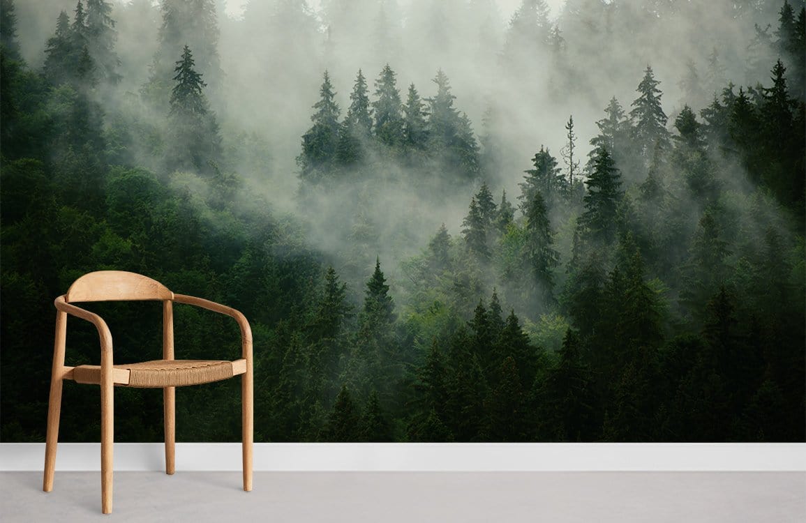 Mystical Misty Forest mural wallpaper in green, featuring a wooden chair on a grey floor.