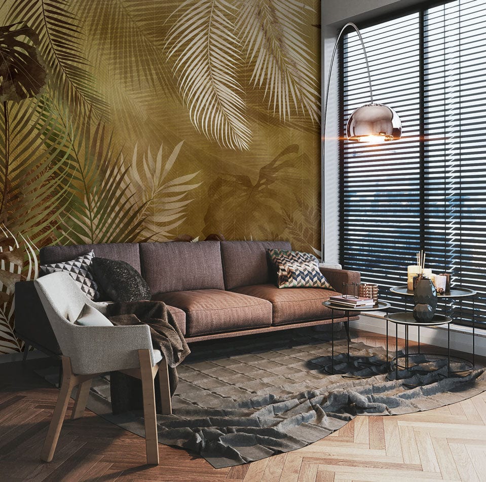 Vintage Tropical Foliage Wallpaper Mural with earthy tones, brown sofa, wooden flooring in modern living room.