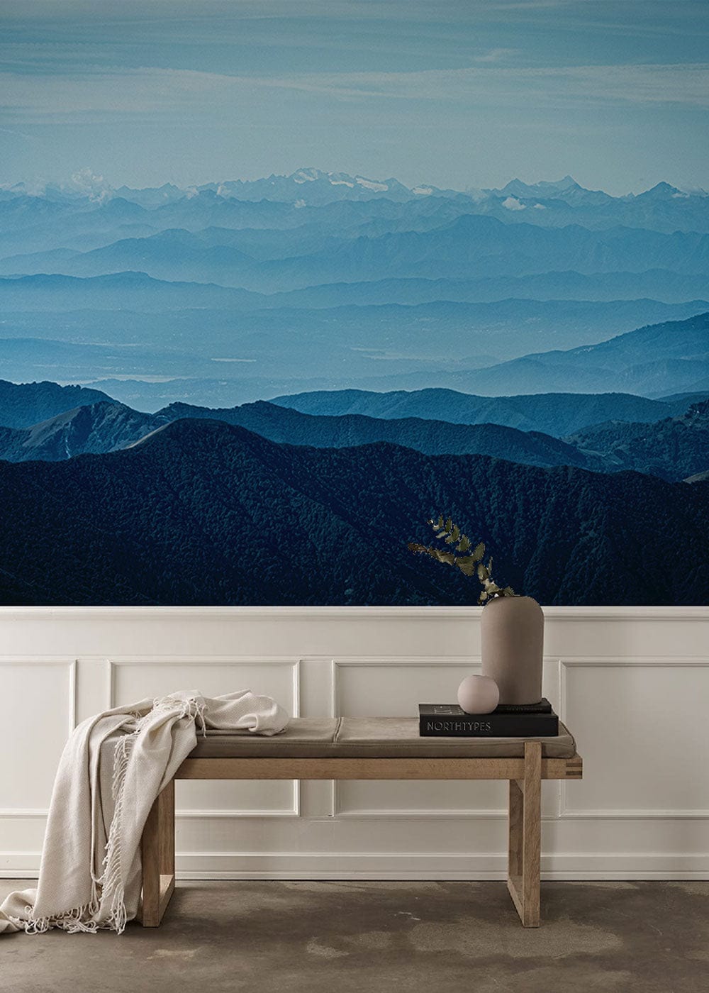 Tranquil Blue Mountain Mural Wallpaper with wooden bench; serene nature Décor in minimalist room.