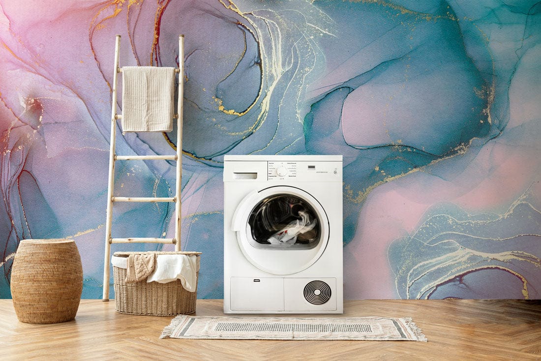Elegant abstract watercolour marble mural wallpaper in blue and pink tones with wooden flooring and ladder.