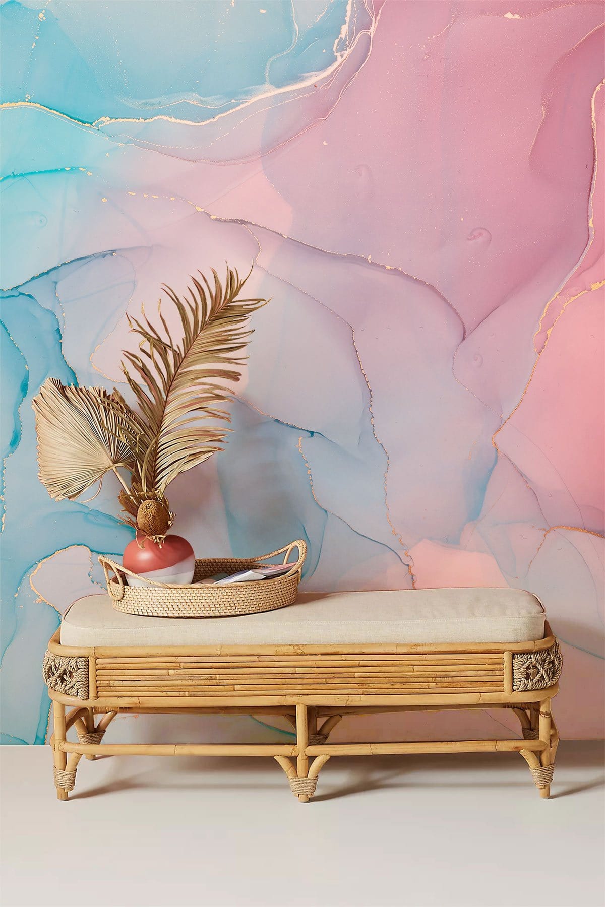 Pastel Dream Watercolour Mural Wallpaper with Gold Accents in modern living room, bamboo bench included.