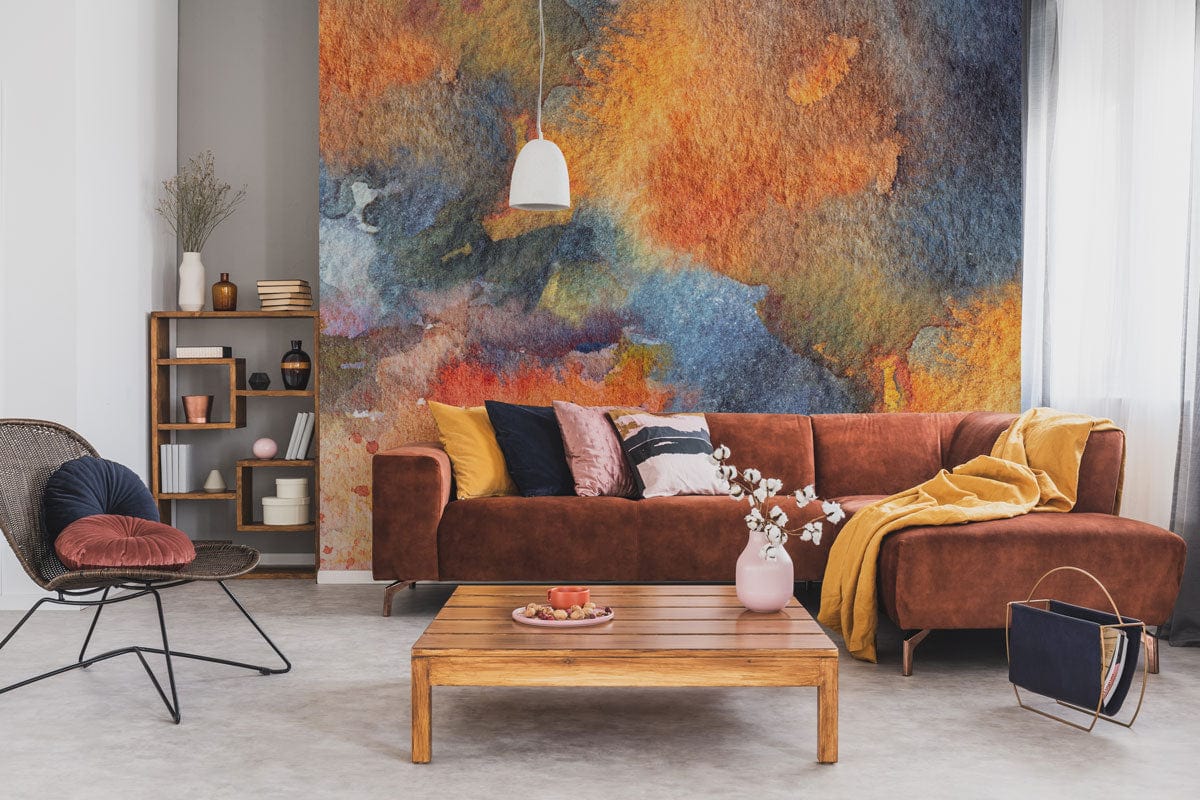 Abstract watercolour mural wallpaper, vibrant autumn hues, brown contemporary sofa, wooden coffee table, modern room.
