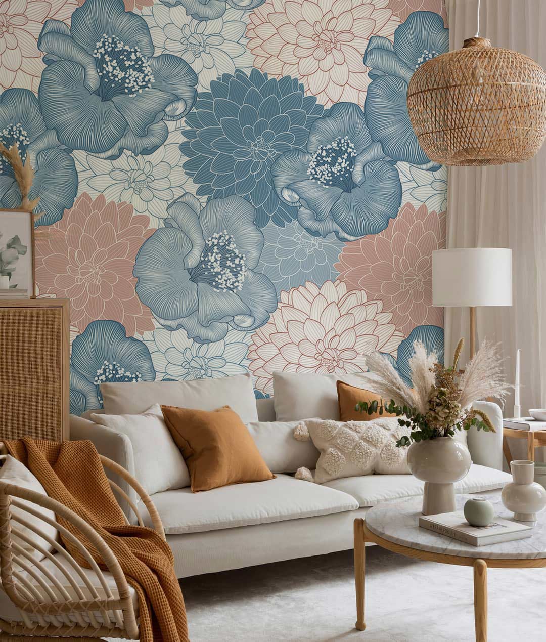Vintage floral wallpaper with blue and peach tones, beige sofa, rattan lamp, elegant living room.