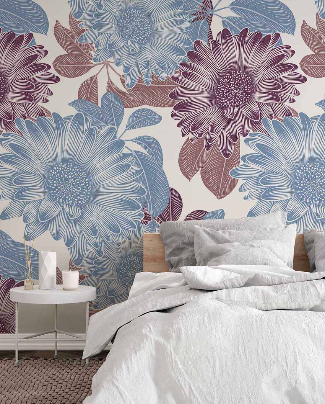 Vintage floral wallpaper in blue, burgundy tones; elegant grey bedding, round bedside table, bedroom setting.
