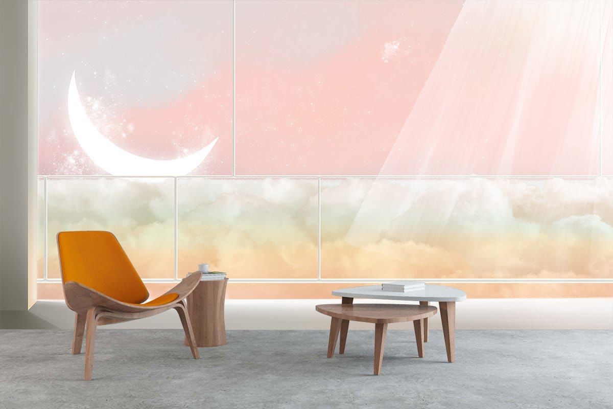 Celestial Dreamscape mural wallpaper with crescent moon, pastel clouds, orange chair, grey carpet flooring.