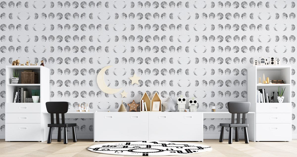 Monochrome lunar wallpaper with white cabinets, grey chairs, wooden flooring in modern living room setting.