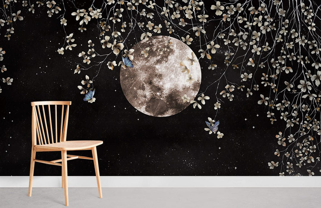 Celestial Night Sky Mural Wallpaper with moon, floral accents, wooden chair, grey flooring, minimal decor.