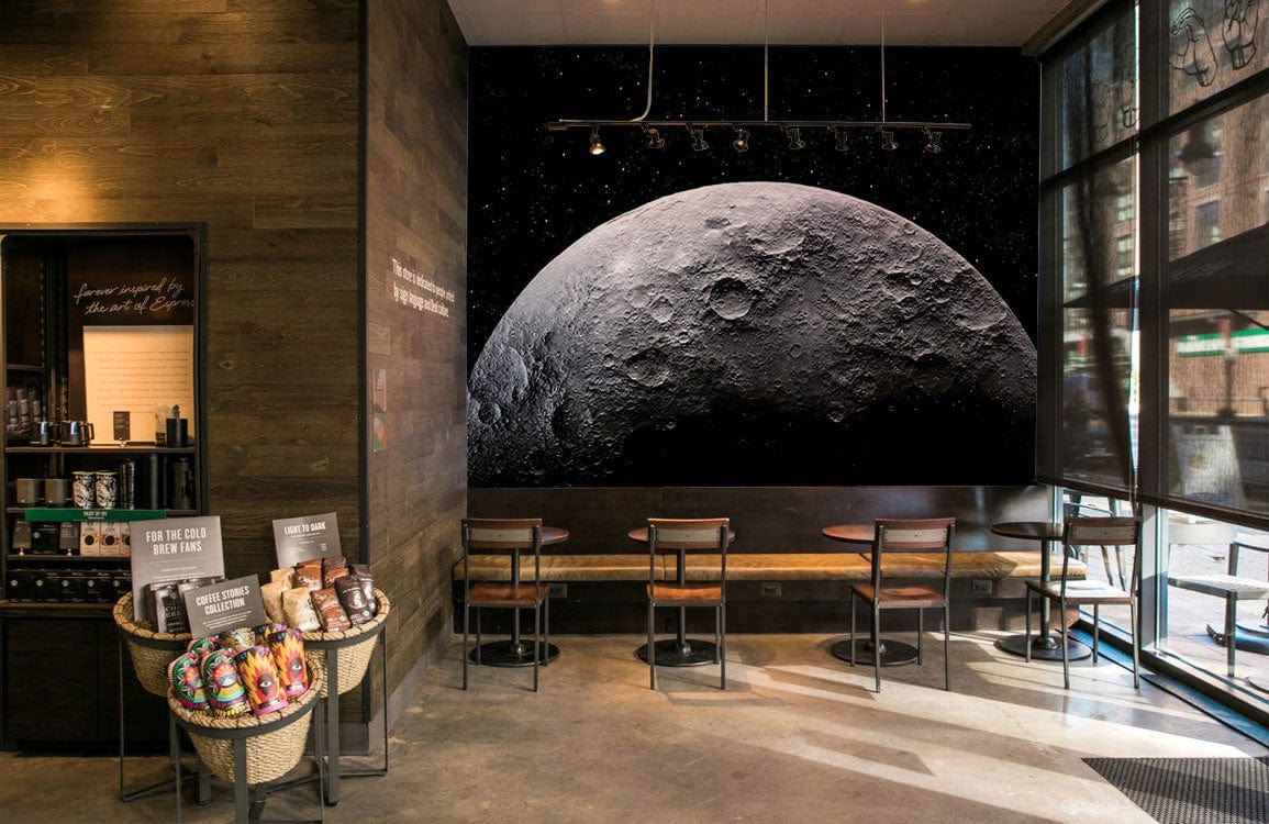 Mystical Lunar Space Adventure Mural Wallpaper, monochrome black and white, coffee shop, wooden chairs, concrete floor.