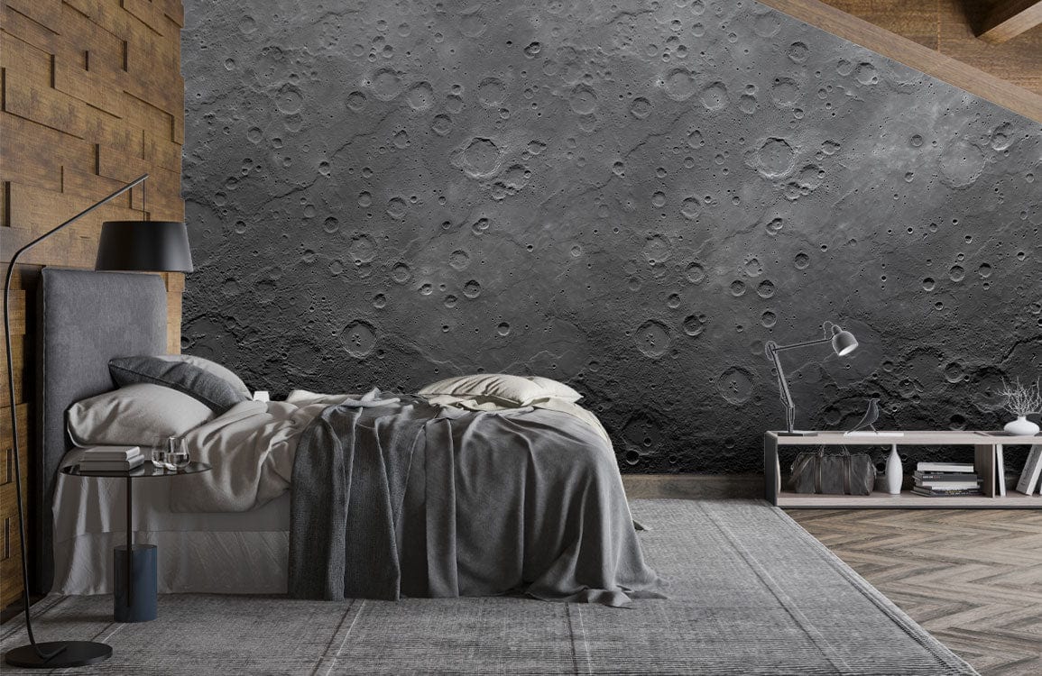 Grey lunar wallpaper, textured craters, modern bedroom; wooden accent wall, grey bedding, rug.