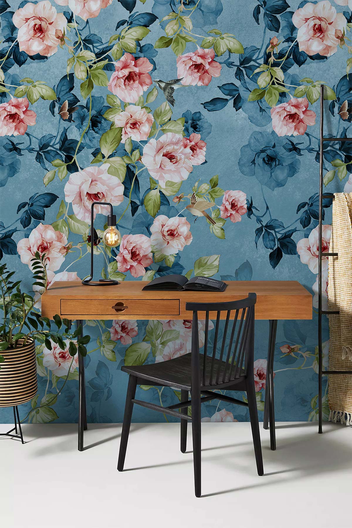 Vintage floral wallpaper featuring blue-pink roses and elegant botanical design in stylish office setting.