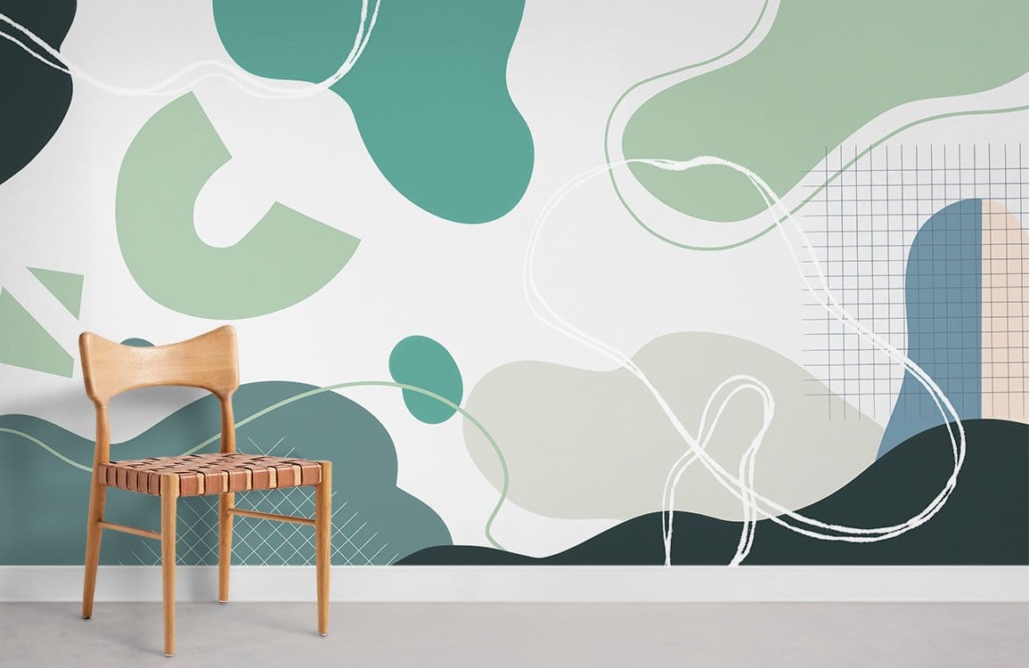 Abstract green and teal geometric mural wallpaper in contemporary room with wooden chair, grey flooring.