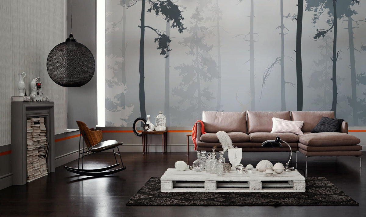Enchanted Misty Forest wallpaper in lounge features brown sofa, dark wood flooring, modern black chair.