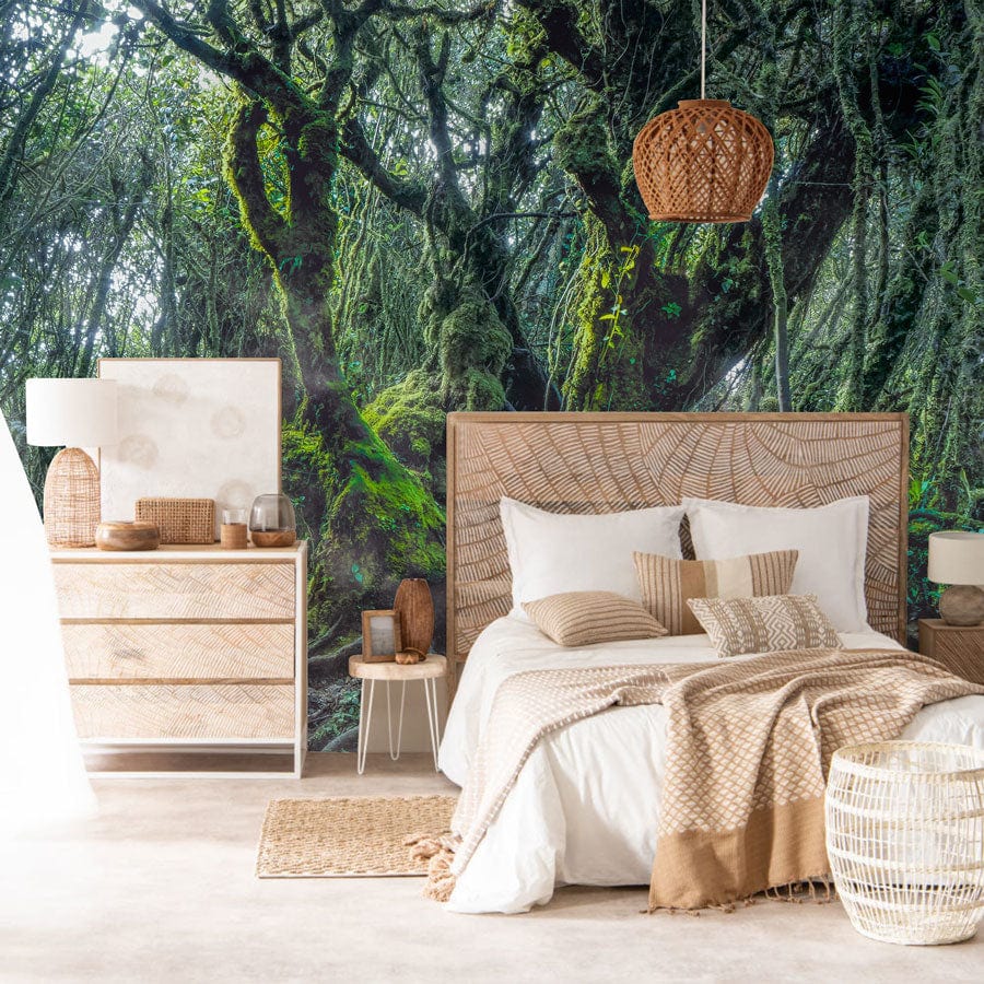 Enchanted Forest Mural Wallpaper in bedroom with rattan furniture, cosy bed, and natural decor.