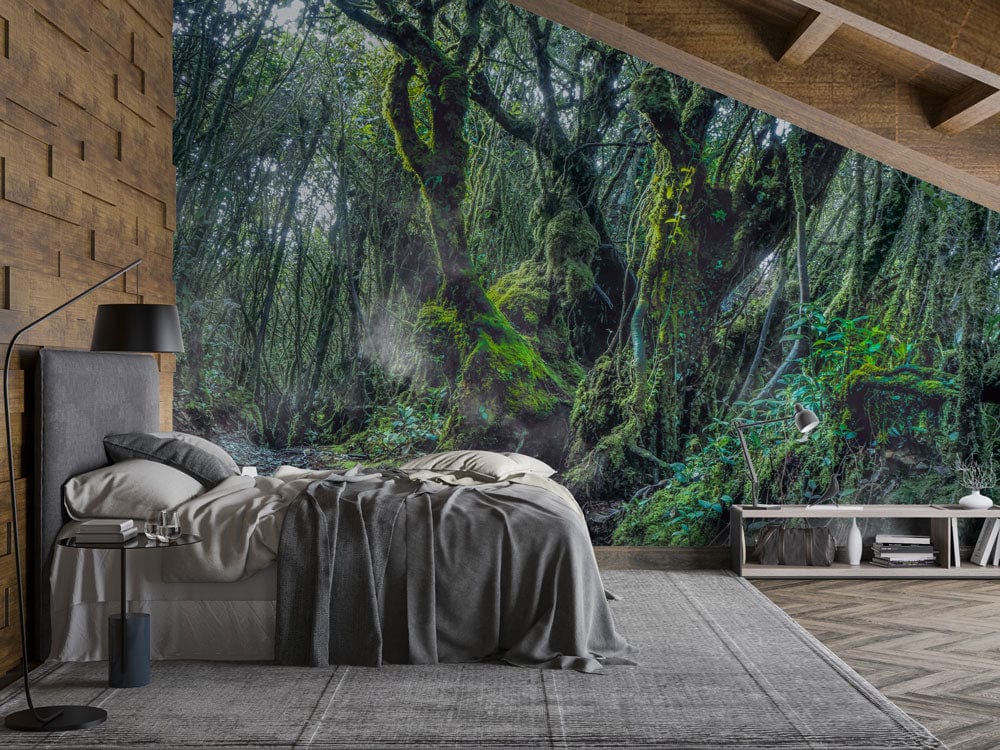 Bedroom with Enchanted Forest Mural, grey bed, wood walls, chevron wood floor, and modern lamp.