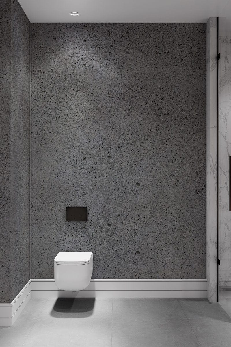 Industrial Grey Concrete Effect Wallpaper in bathroom; minimalist urban decor with white skirting, grey flooring.