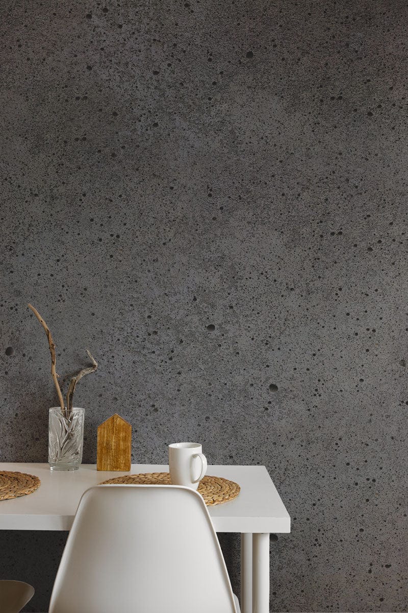 Industrial Grey Concrete Effect Wallpaper in dining room with white table, minimalist chair, modern decor.