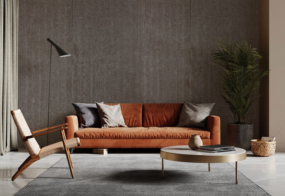 Urban Grey wallpaper in modern living room with orange sofa, grey carpet, and wooden chair.