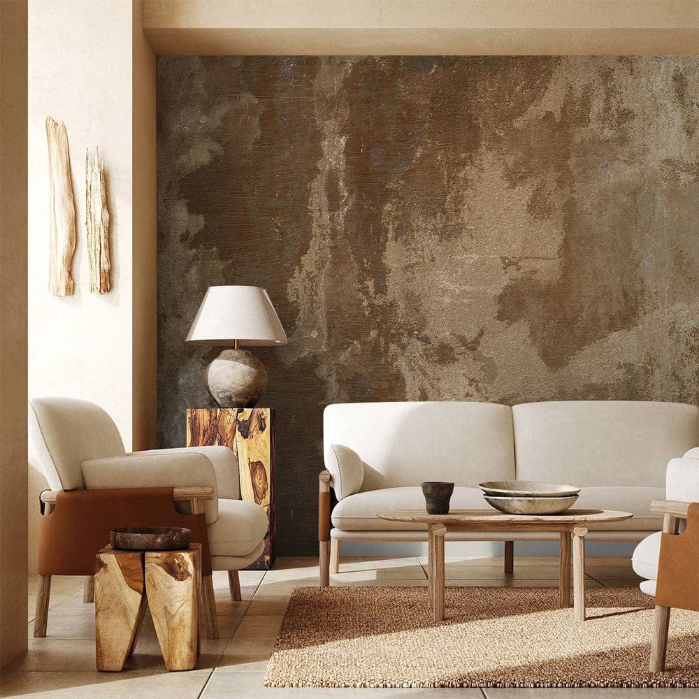 Abstract rustic brown and beige mural wallpaper; vintage interior with beige sofa, armchairs, and rug.
