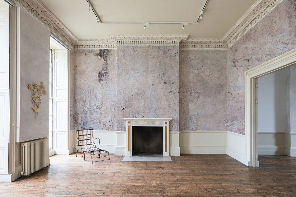 Abstract vintage textured wallpaper in a classic living room with fireplace, wooden flooring, beige tones.
