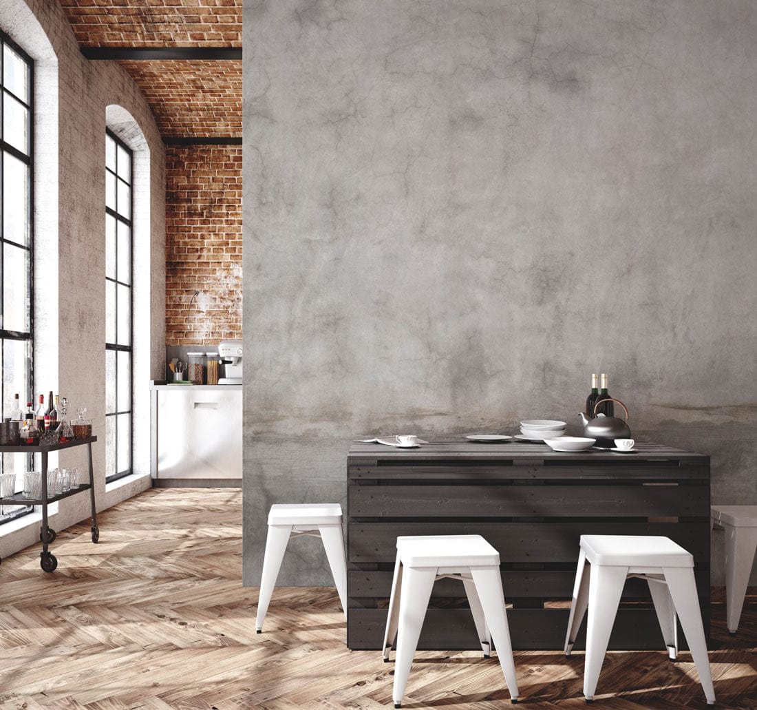 Subtle Vintage Concrete Texture Wallpaper in grey, industrial dining room, wooden parquet flooring, dining table.
