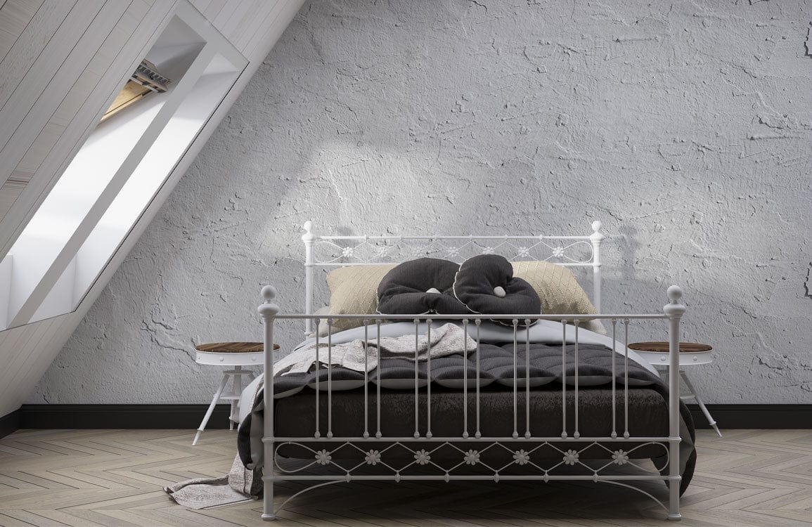 Alt text: Bedroom with Elegant Textured Grey Plaster Effect Wallpaper, metal bed, wooden flooring, attic window.