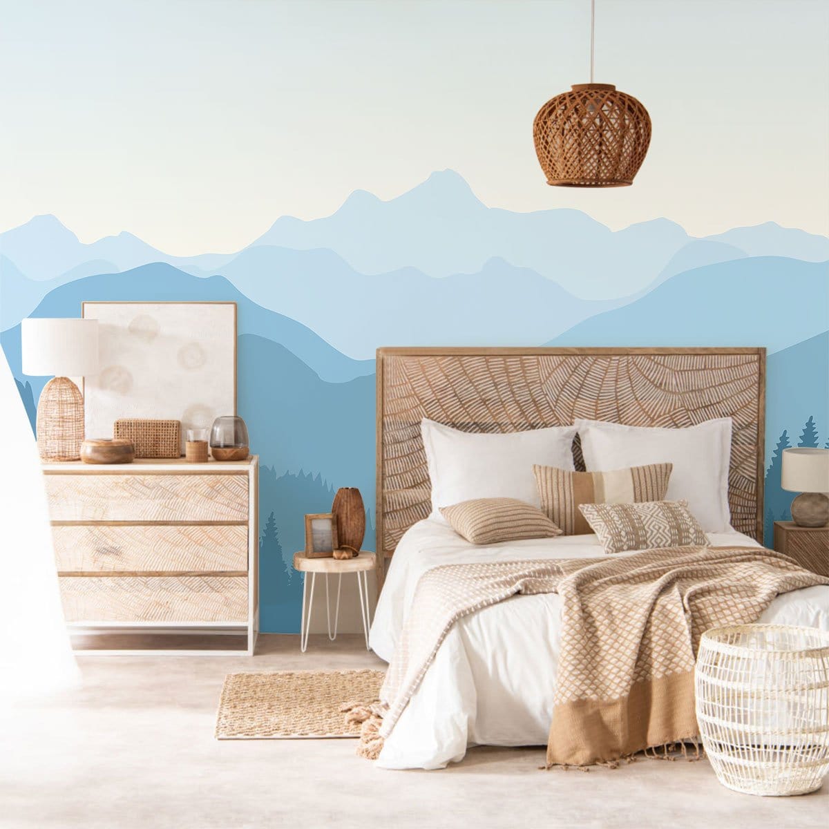 Tranquil blue mountain mural wallpaper in serene bedroom with wicker bed, wooden dresser, and pendant light.