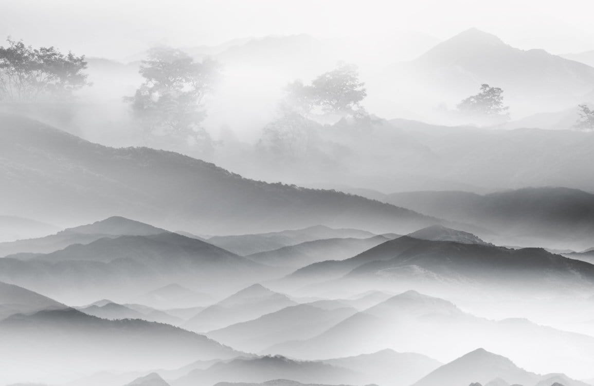 Serene Misty Mountain Landscape Mural Wallpaper in Monochrome Grey Tones