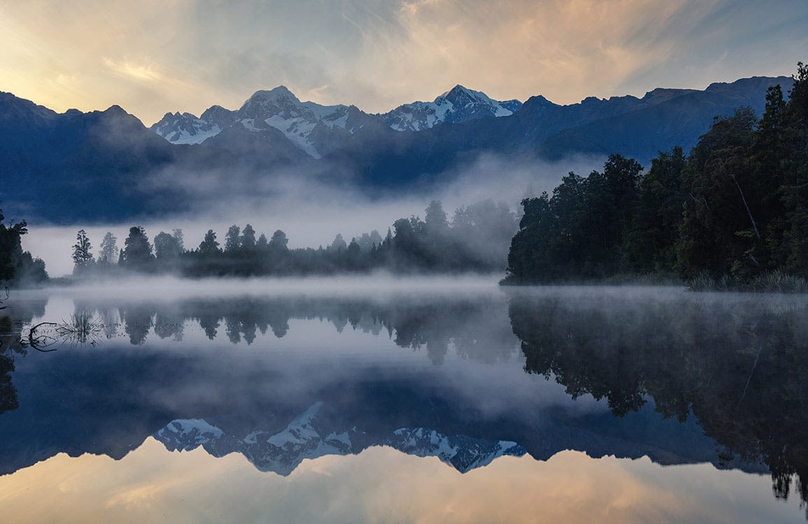 Tranquil Mountain Lake Reflection Mural Wallpaper in Serene Blue Tones