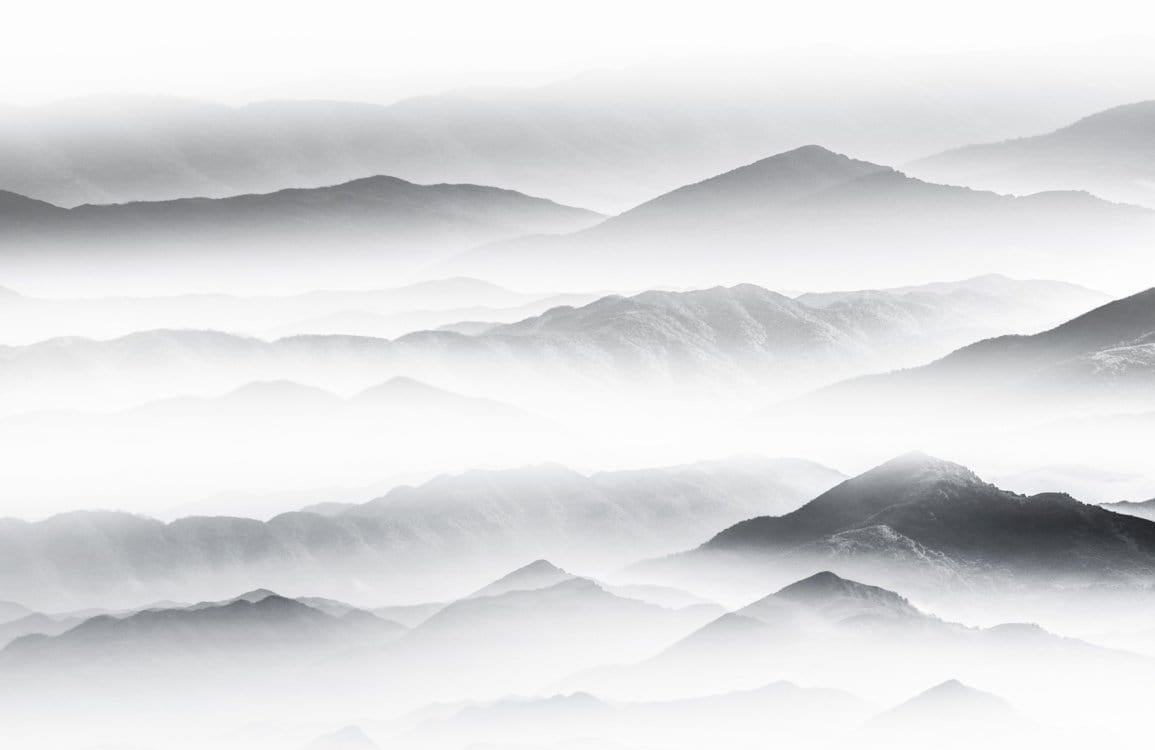 Serene Misty Mountain Landscape Mural Wallpaper in Grey and White Tones